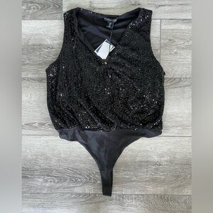 Woman’s black sequined body suit! New with tags size L